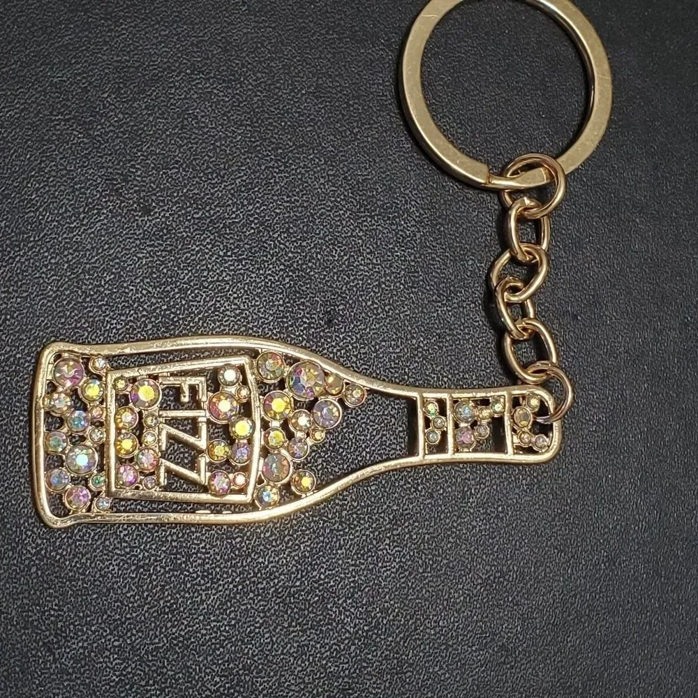 Gold tone Fizz bottle keychain